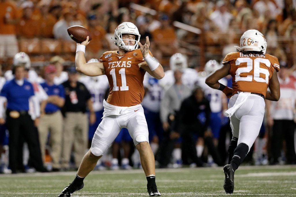 AUSTIN, TX - AUGUST 31:  Sam Ehlinger #11 of the Texas Longhorns throws a pass in the third...