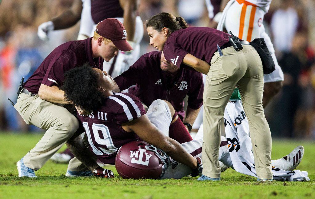 Texas A&M Aggies linebacker Anthony Hines III (19) is looked at after an injury during the...