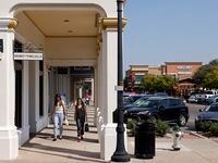 Shoppers at Southlake Town Square pass by Brandy Melville in Southlake, Texas, October 10,...