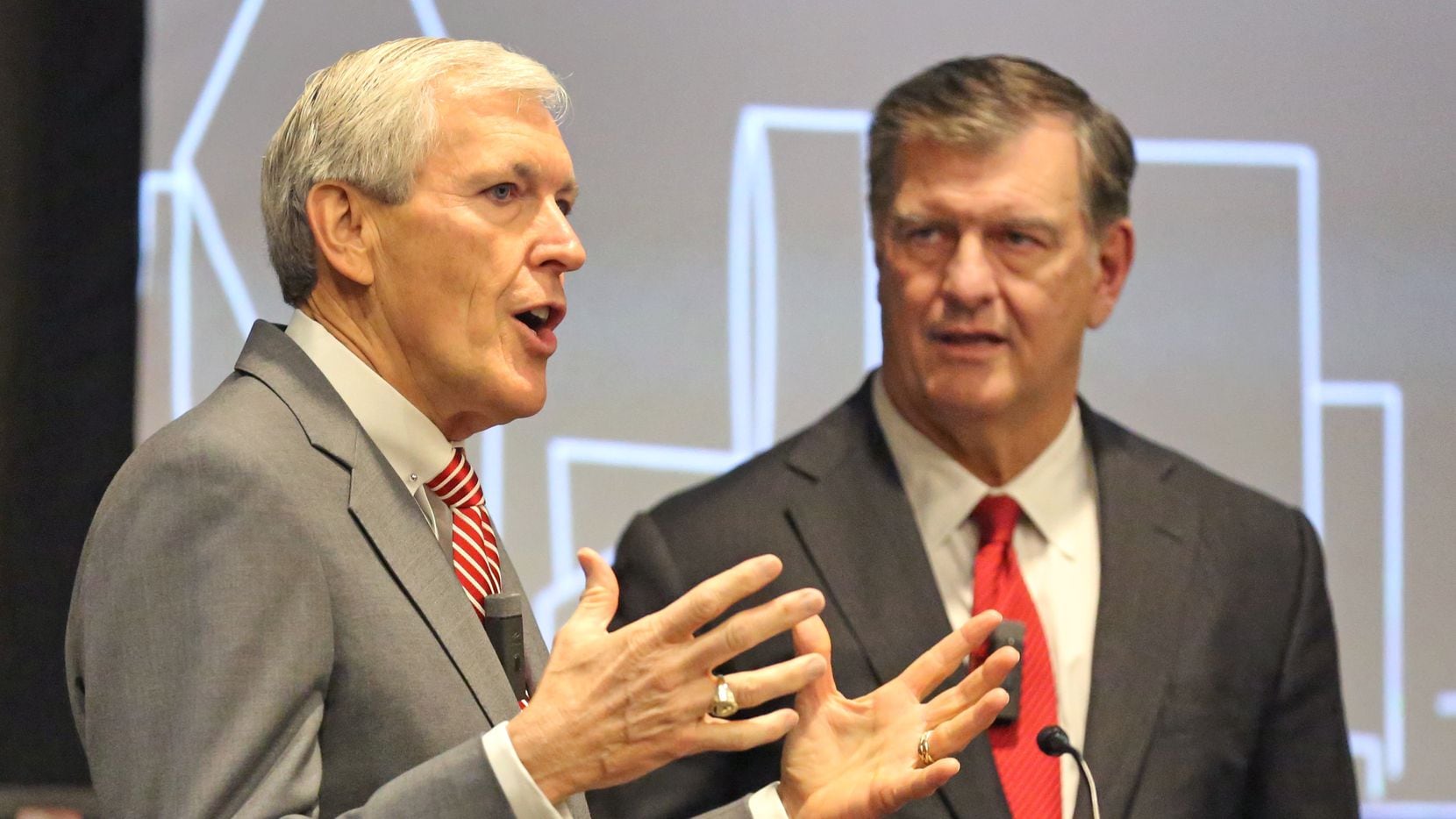 Former mayors Tom Leppert and Mike Rawlings, right, during an event at the Federal Reserve...