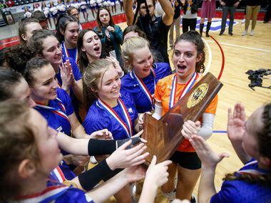 Trophy Club Byron Nelson Bobcats celebrate after winning the class 6A volleyball state final match against Plano West at the Curtis Culwell Center in Garland, on Saturday, November 23, 2019. Nelson won the fifth set 15-7 to become the title champions. (Juan Figueroa/The Dallas Morning News)