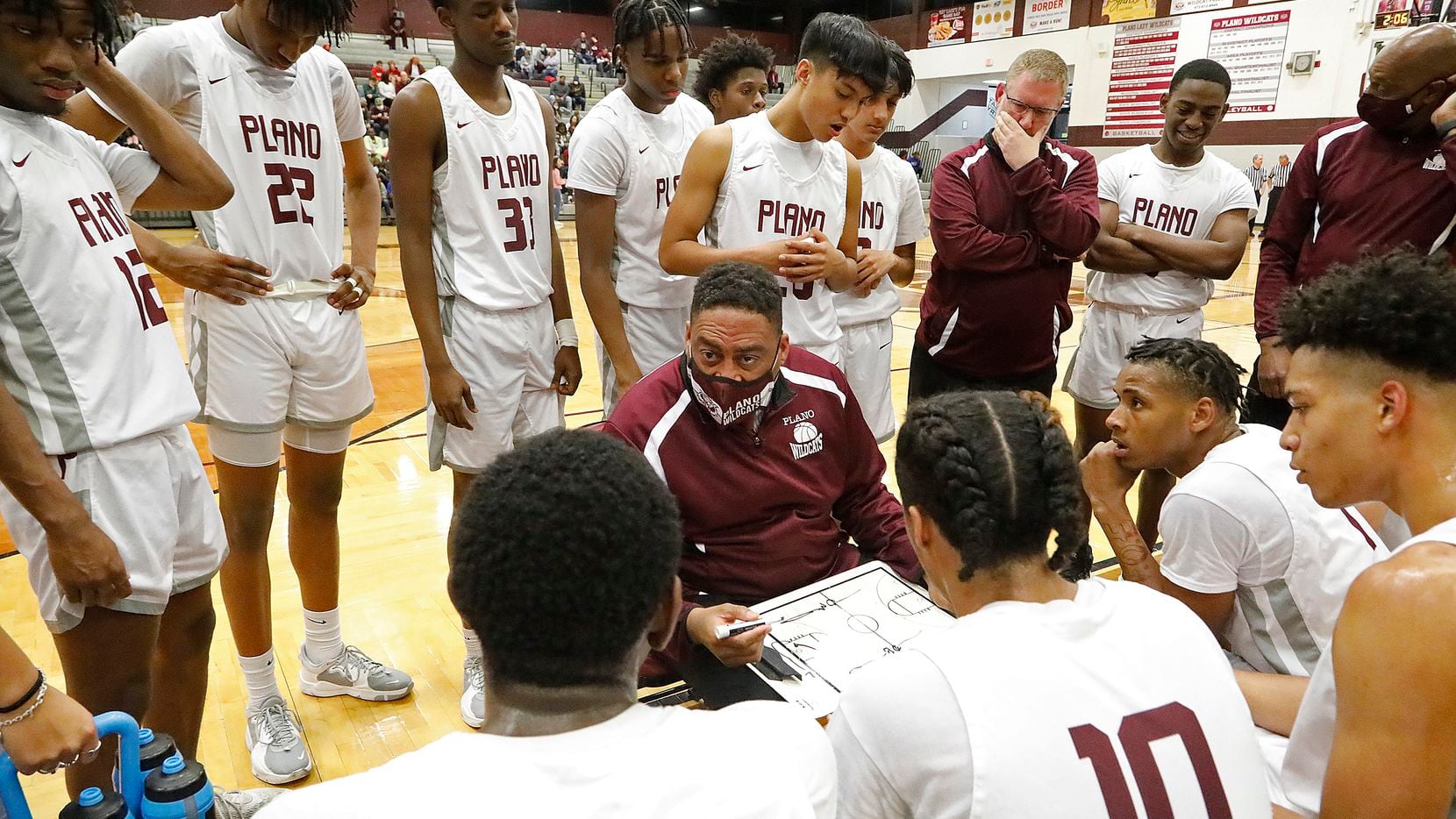 Plano Senior High School head coach Dean Christian draws up a play during a time out in the second half as Plano High School hosted Flower Mound High School in a basketball game played in Plano on Tuesday, January 11, 2021. (Stewart F. House/Special Contributor)