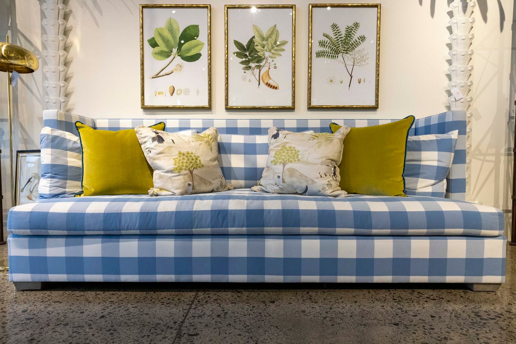 This blue-and-white checked sofa is for sale for $13,500 at Coco & Dash in Dallas and has...
