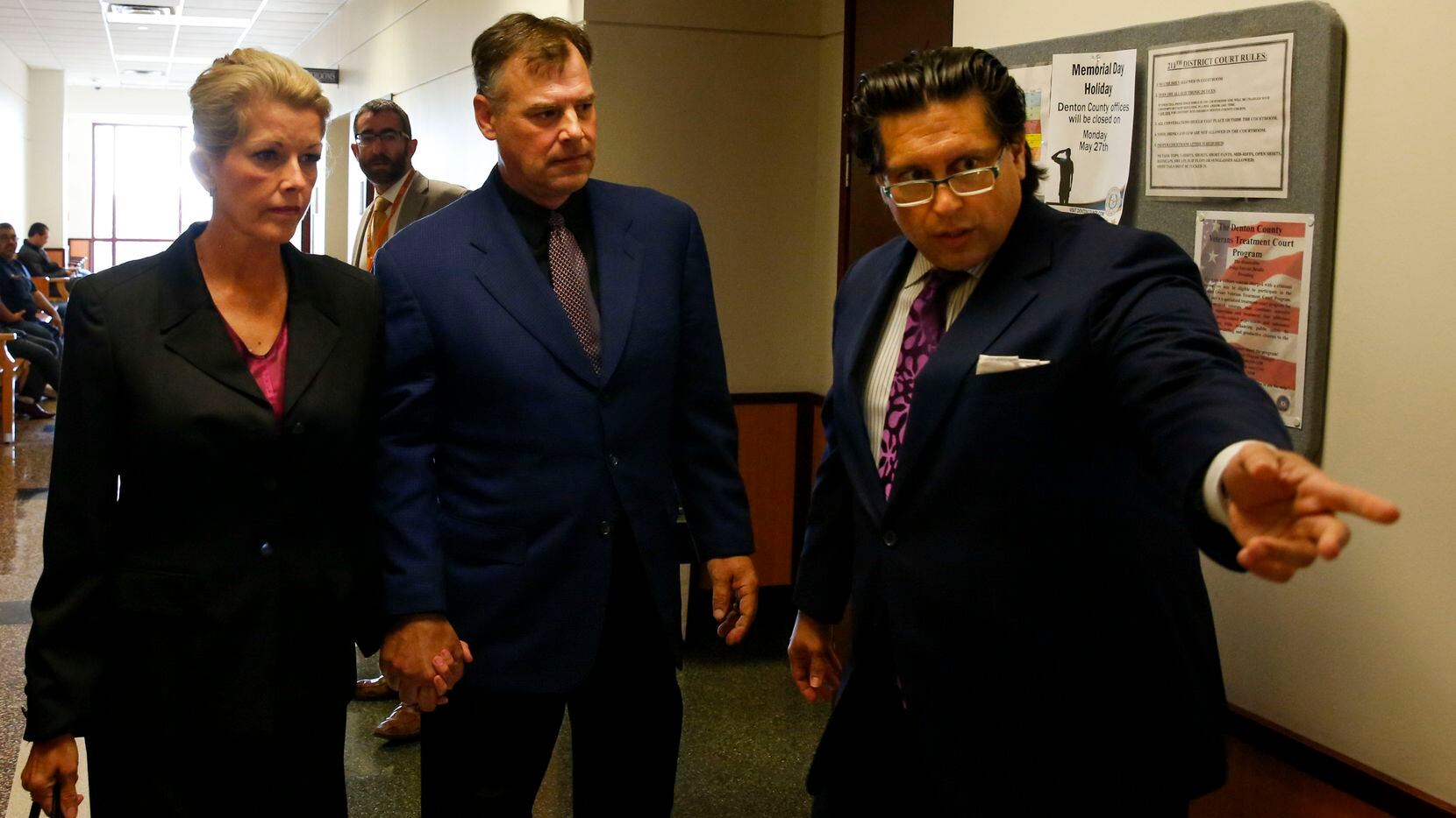 Attorney Derek Adame (right) directs former Texas Rangers pitcher John Wetteland and his...