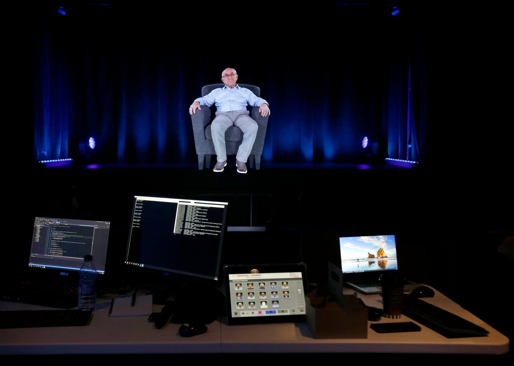Technicians are making final adjustments to a holographic image of Holocaust survivor Max...