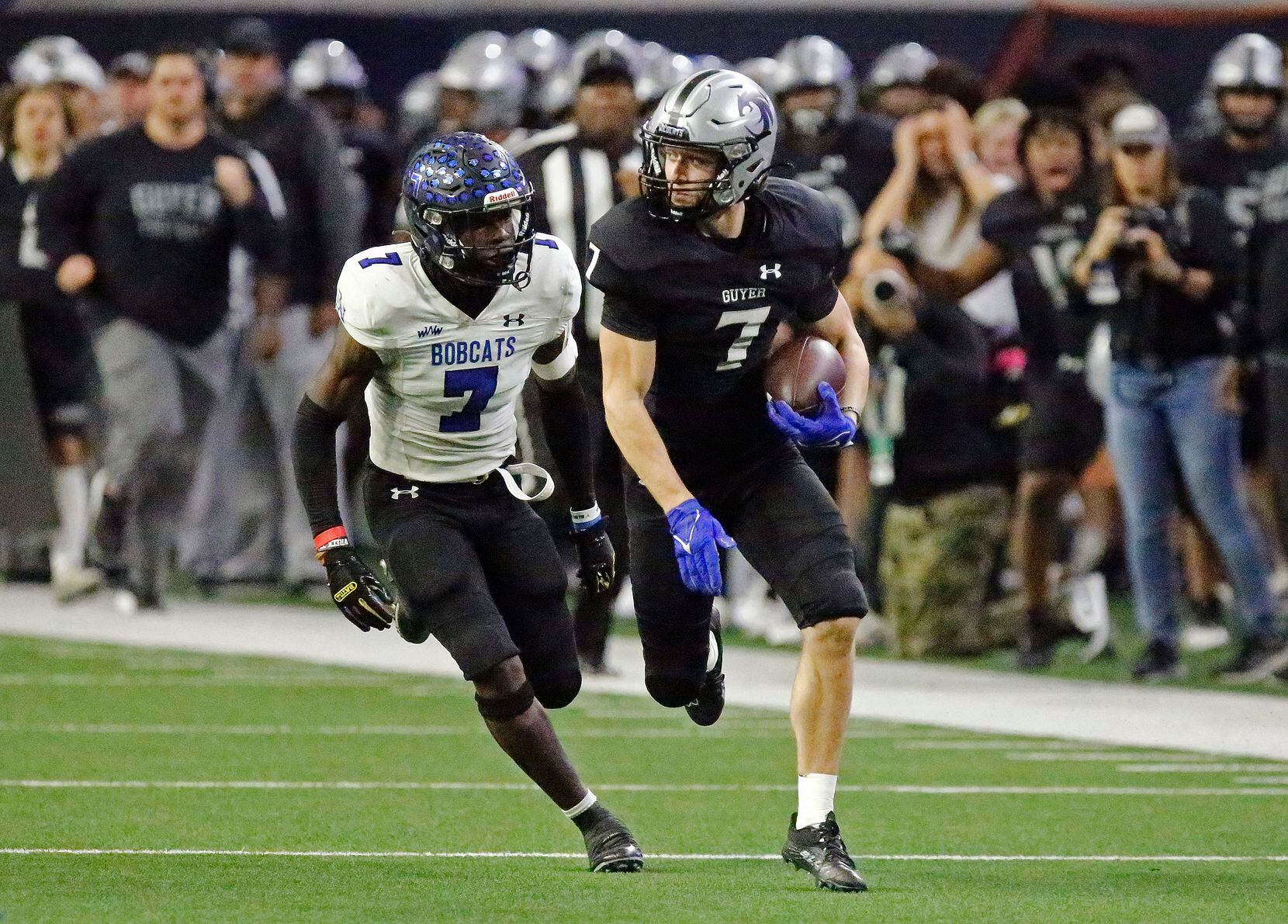 Guyer High School wide receiver Landon Sides (7) is chased by Byron Nelson High School...