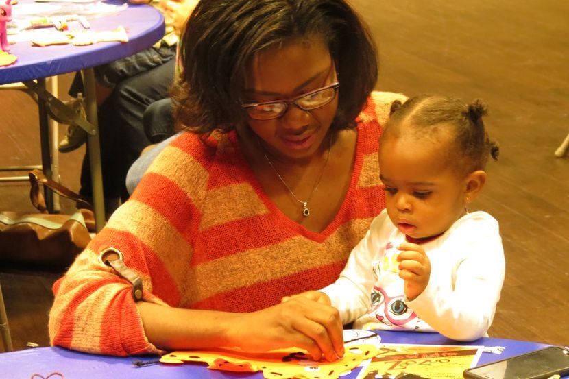 Families with young children work on crafts during one of Irving Arts Center's free monthly...