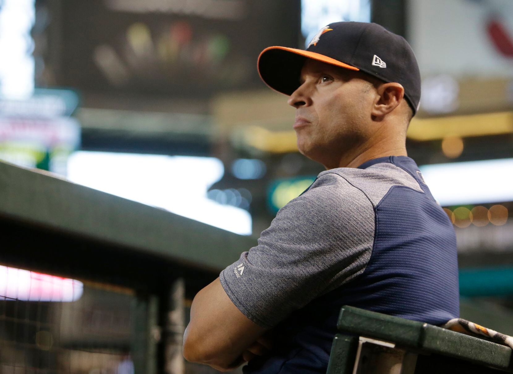Houston Astros bench coach Joe Espada (20) in the first inning during a baseball game...