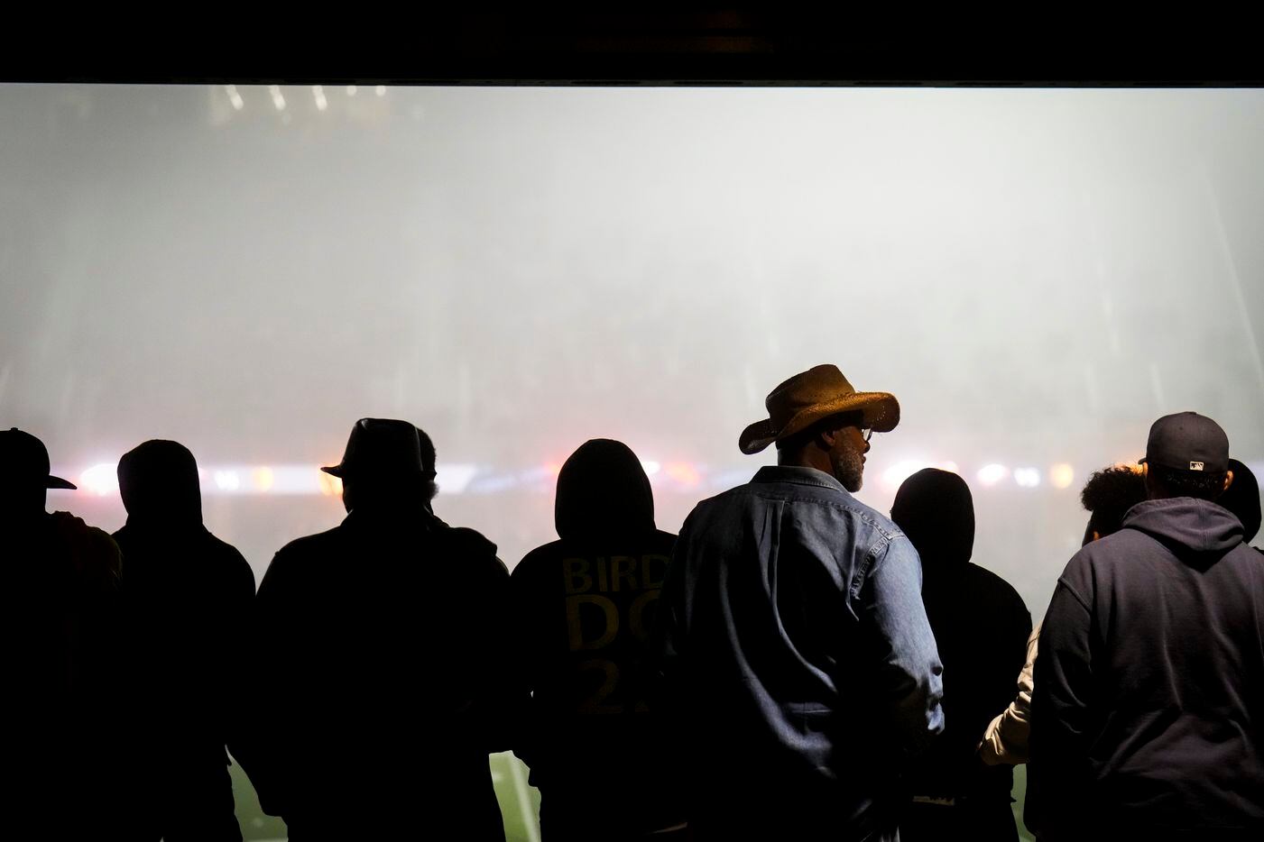 South Oak Cliff fans watch as fog shrouds the stadium during the second half of a Class 5A...