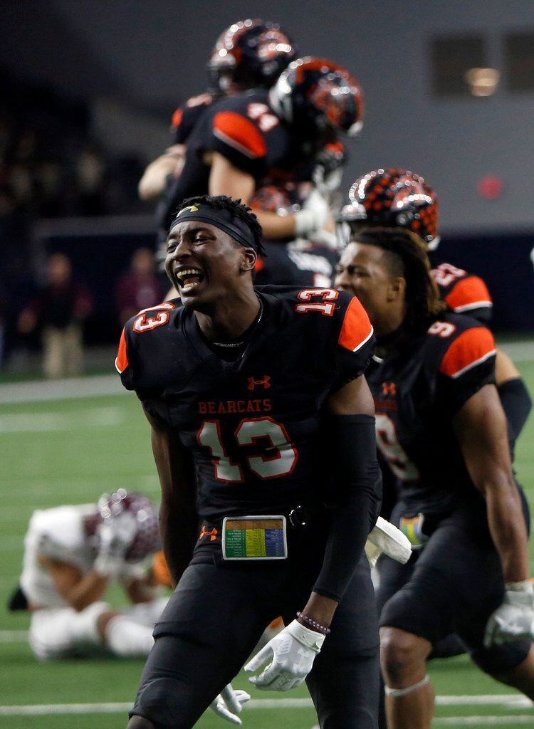 Aledo Bearcats players, including Money Parks (13) celebrate their 43-36 overtime victory over Ennis to advance. The two teams played their Class 5A Division ll Regional final playoff football game at Frisco Center at The Star in Frisco on December 6, 2019. (Steve Hamm/ Special Contributor)