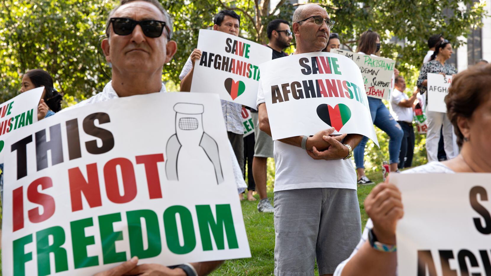 Rhaman Ayoubi and Nasim Shakeed joined dozens of demonstrators showing their support Saturday at Civic Garden in downtown Dallas for people who are trying to escape Afghanistan.