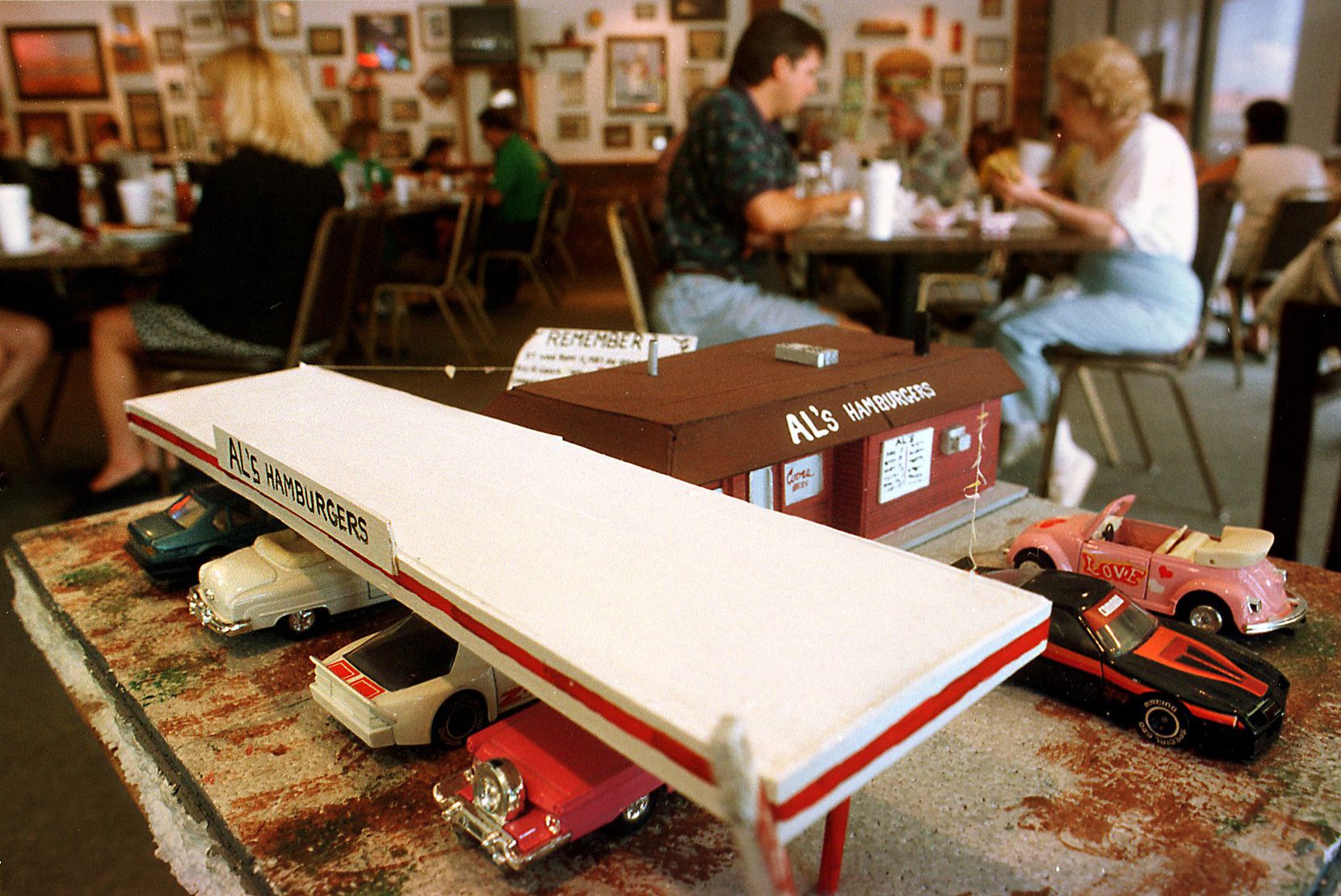 In this 1997 file photo, a model of the old drive-in greets customers at Al's Hamburgers at...