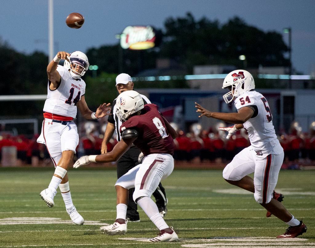 McKinney Boyd sophomore quarterback Carter Whitefield (14) releases a throw before the rush...