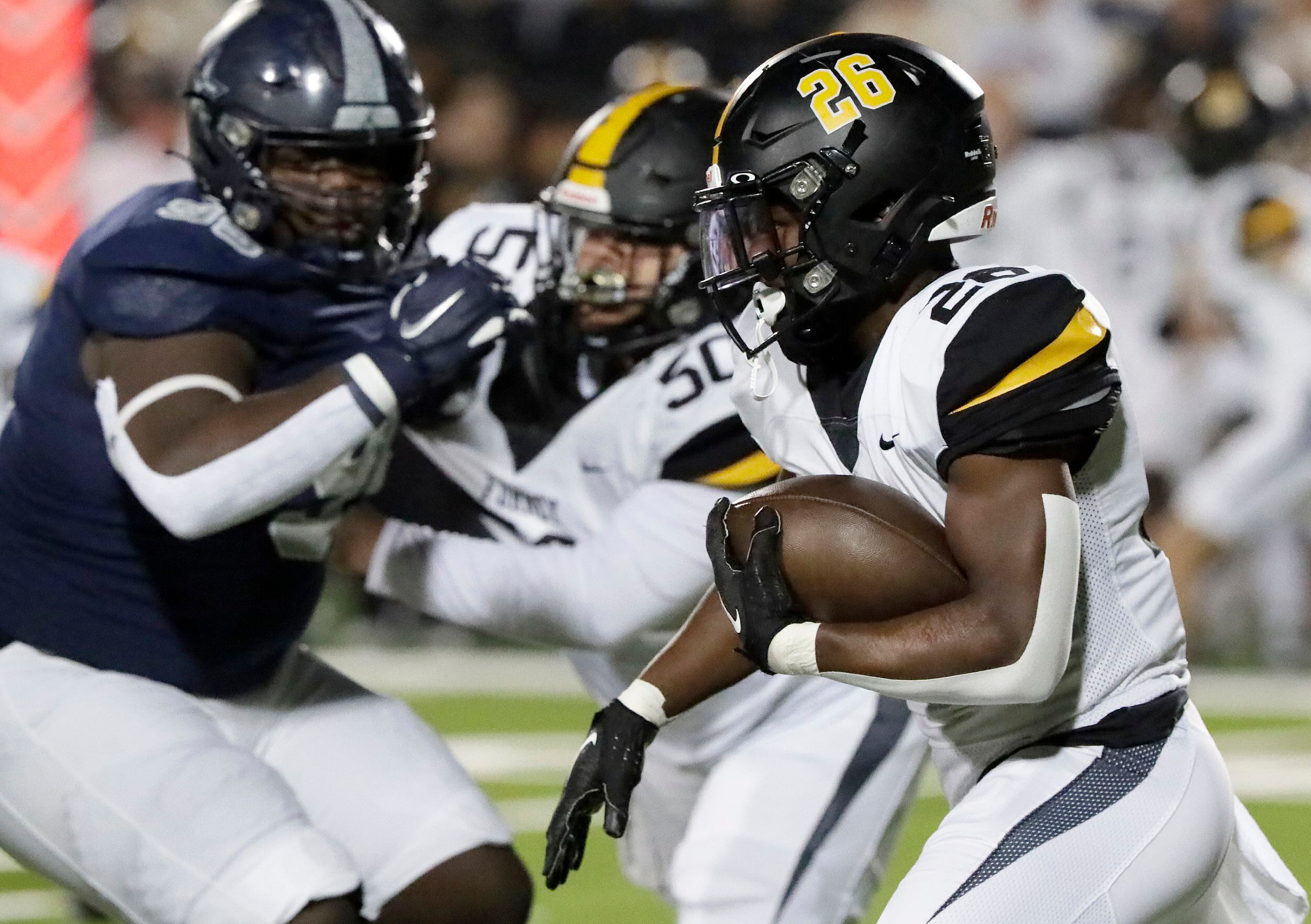 Forney High School running back Javian Osborne (26) carries the football during the first...