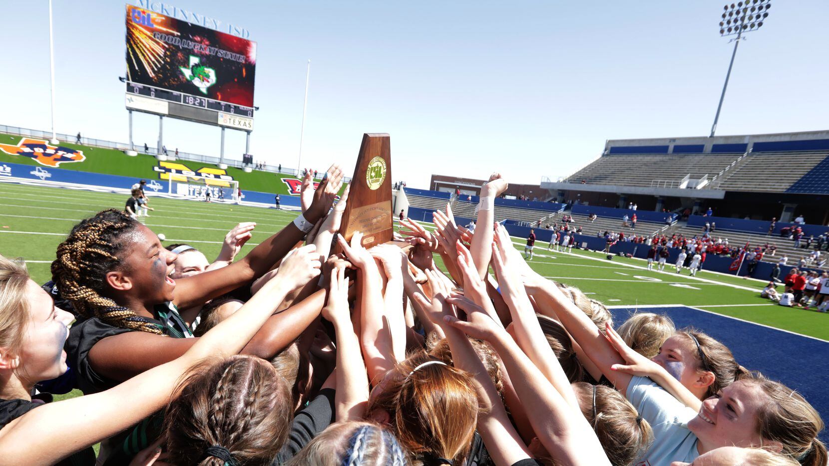 Southlake Carroll players celebrate after winning during a Class 6A Region I championship...