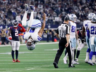 Dallas Cowboys wide receiver KaVontae Turpin (9) performs a back flip on the final play of...