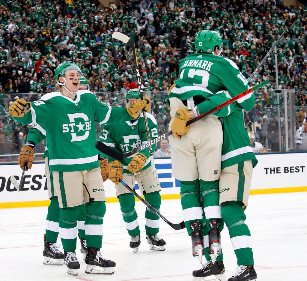 Dallas Stars center Mattias Janmark (13) jumps into the arms of defenseman ...