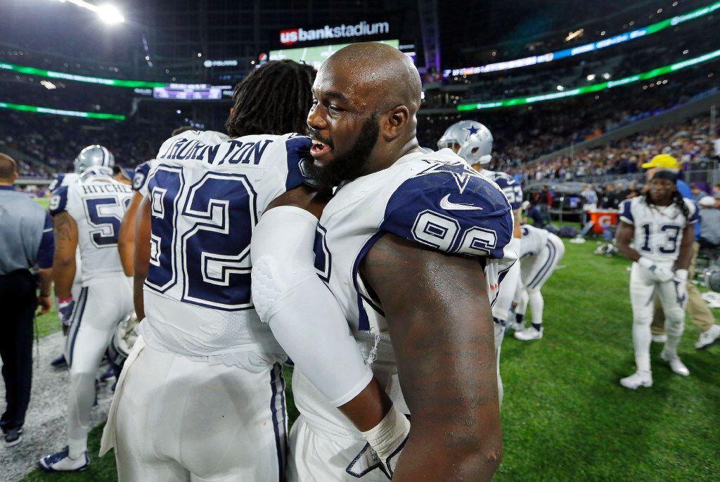 FILE - Dallas Cowboys defensive tackles Maliek Collins (96) and Cedric Thornton (92) congratulate each other as they defeated the Minnesota Vikings at U.S. Bank Stadium in Minneapolis, Minnesota, Thursday, December 1, 2016. (Tom Fox/The Dallas Morning News)