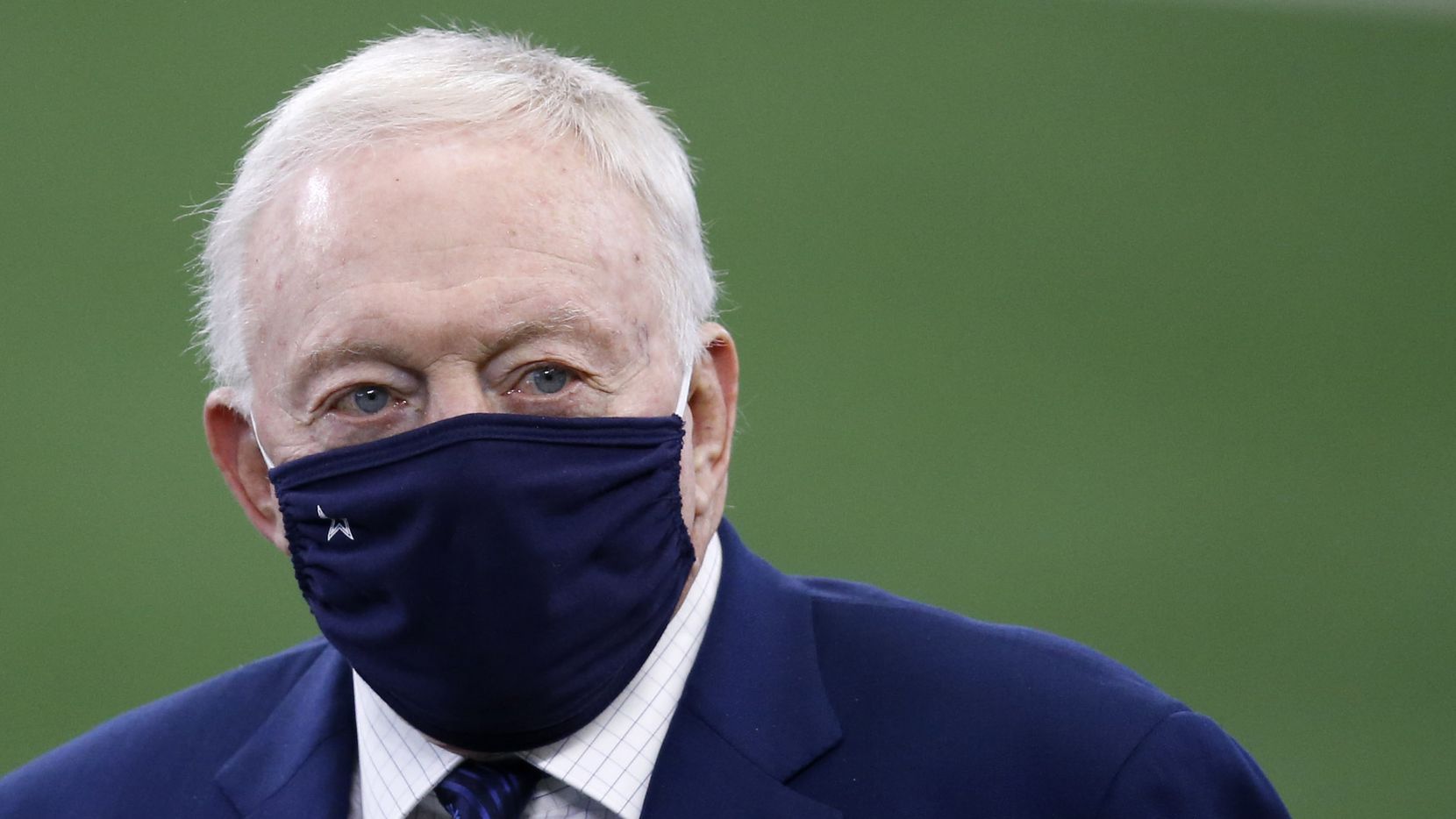 Dallas Cowboys owner and general manager Jerry Jones walks the field during warmups before a...