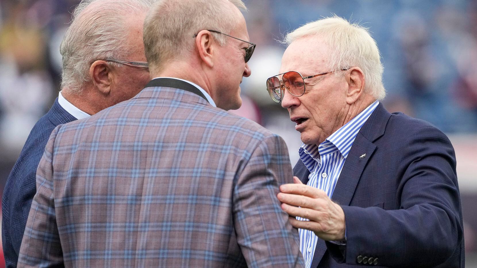 Dallas Cowboys owner and general manager Jerry Jones (right) talks with executive vice...