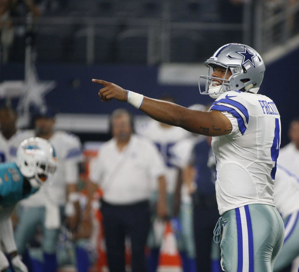 Dallas Cowboys quarterback Dak Prescott (4) calls out against the Miami Dophins at AT&T...