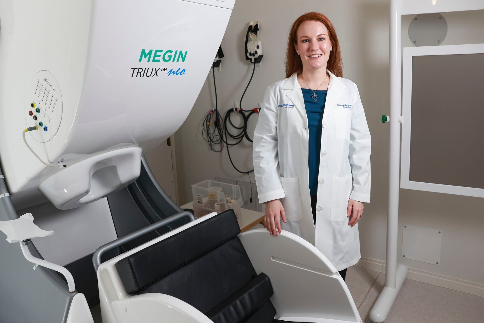 Assistant Professor of Radiology at UT Southwestern, Elizabeth Davenport stands next to a...