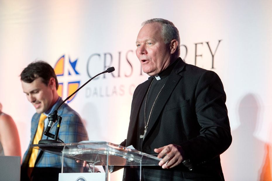 Edward J. Burns, bishop of Dallas, gives the invocation at a Draft Day ceremony at Cristo...