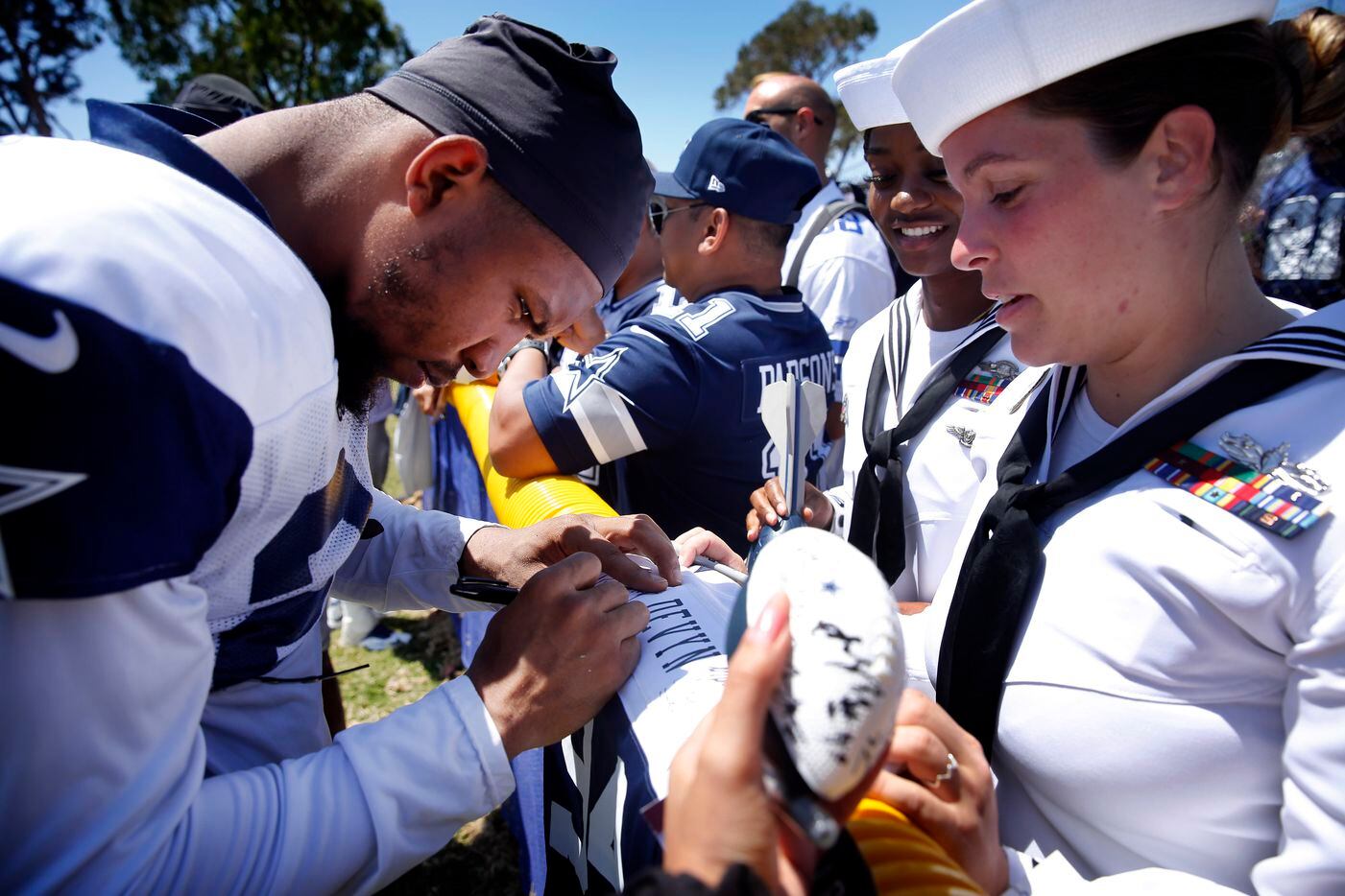 Dallas Cowboys running back Tony Pollard (20) singed an autograph for Navy logistics...