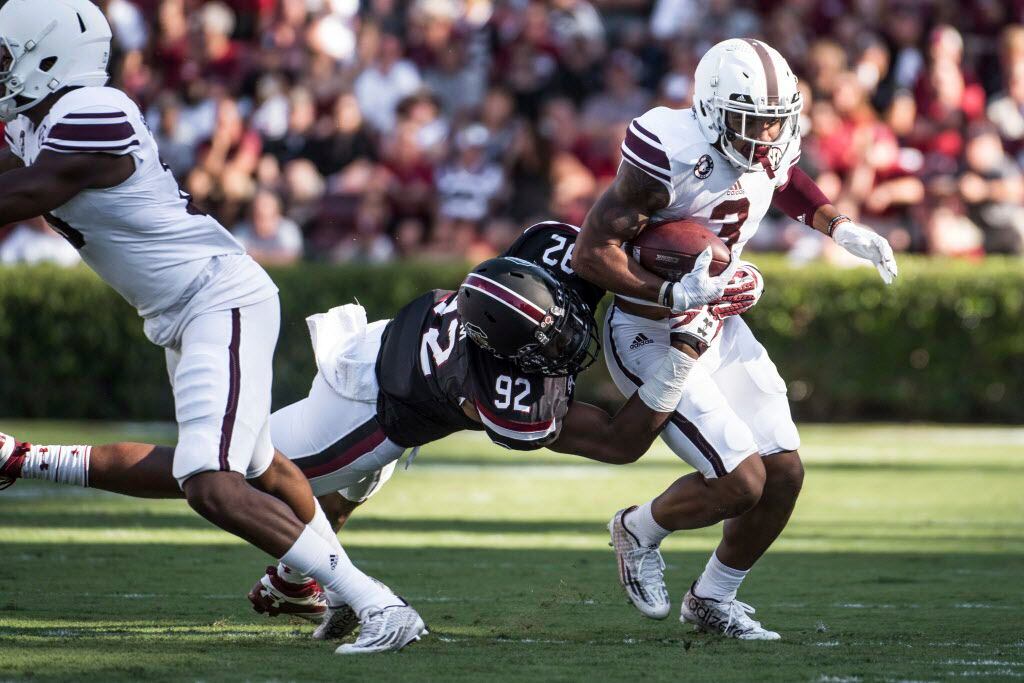 Texas A&M wide receiver Christian Kirk (3) attempts to elude South Carolina defensive...