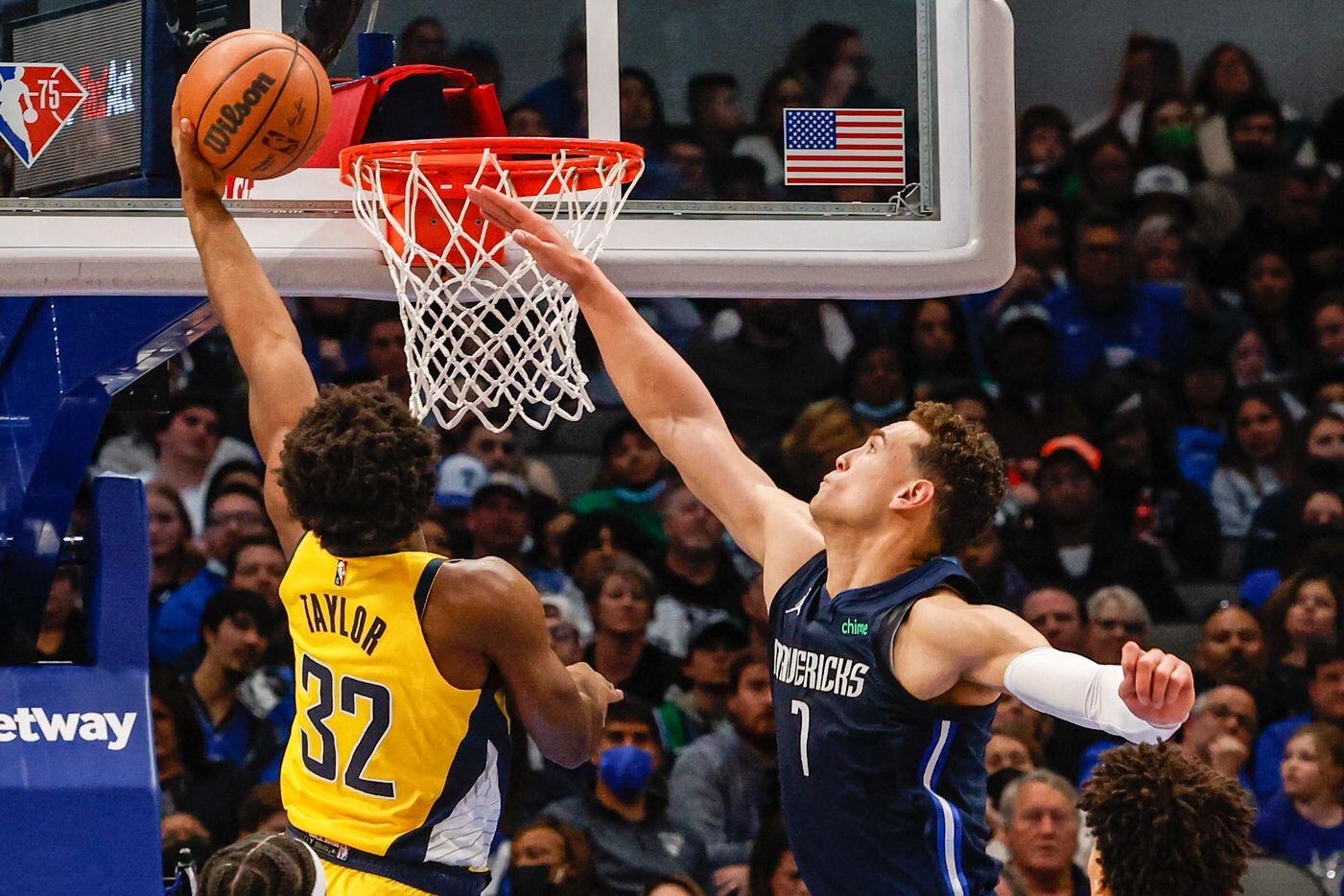 Indiana Pacers guard Terry Taylor (32) goes to the basket as Dallas Mavericks center Dwight Powell (7) tries to block him during the second half at the American Airlines Center in Dallas on Saturday, January 29, 2022.