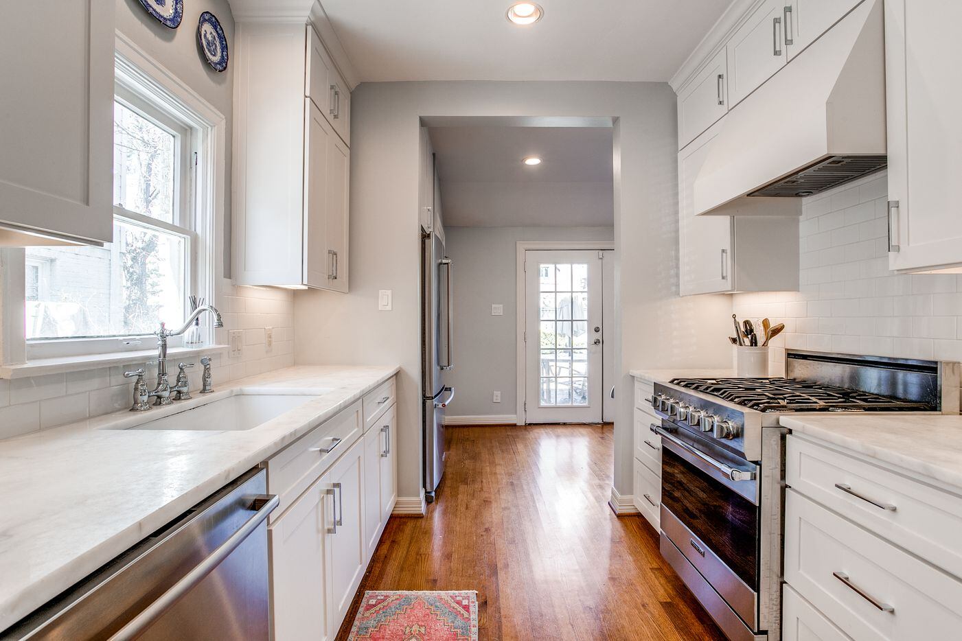 Find marble countertops and stainless-steel appliances in the renovated kitchen.