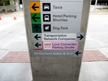A sign shows the location of the dog park at Dallas Love Field Airport in Dallas on...