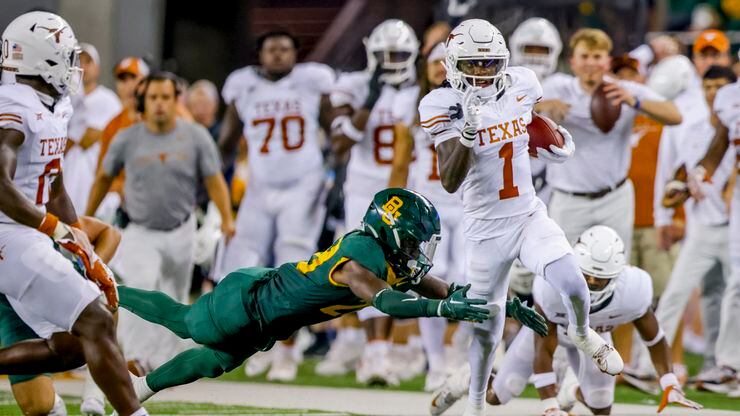 Texas' Xavier Worthy (1) returns a Baylor punt during the first half of an NCAA college...