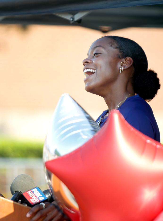 Jasmine Moore beams as she speaks with members of the media during a press conference for the track star as part of a Mansfield ISD send-off  party. The Olympic Send-Off for the Mansfield Lake Ridge graduate began at Vernon Newsom Stadium as the caravan ended at Danny Jones Middle School in Mansfield on July 21, 2021. (Steve Hamm/ Special Contributor)