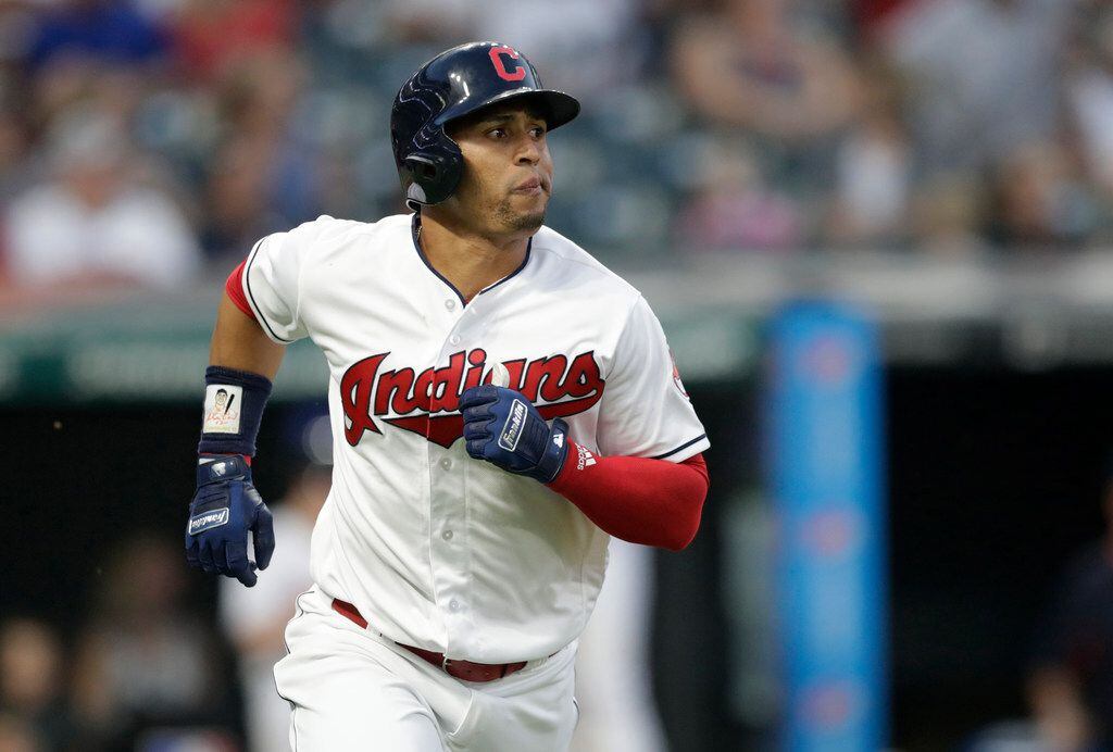 Cleveland Indians' Leonys Martin watches his ball after hitting a solo home run off Los...