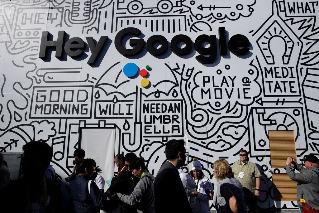 People wait in line Wednesday to enter the Google booth at CES International, in Las Vegas. 