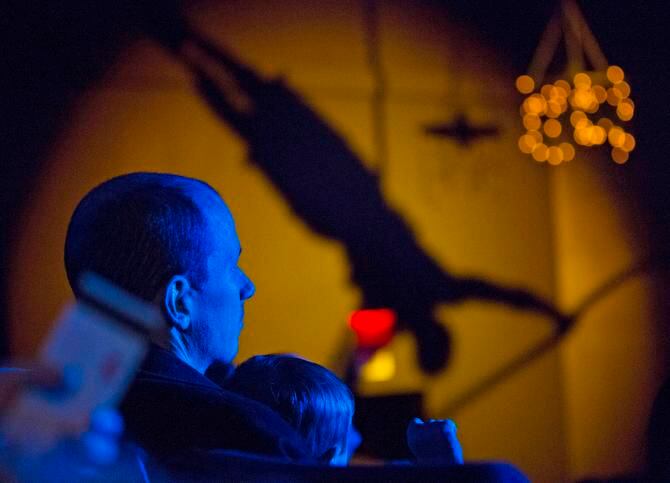 
An audience member watches as Asaf Mor performs during the annual Lone Star Circus show Oh...