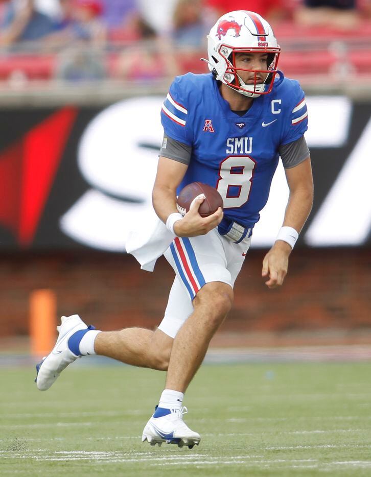 SMU quarterback Tanner Mordecai (8) scampers for a first down during the first half of their...