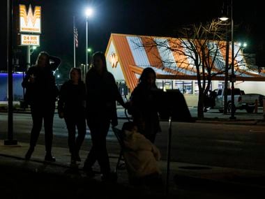 Community members walk to a candlelight vigil for Zechariah Trevino, 17, at University...