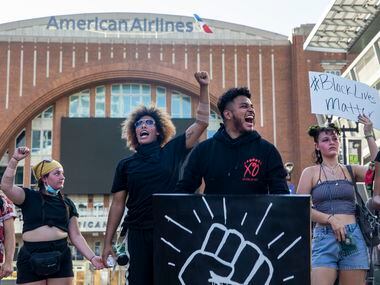 Miguel Ibarra (center right) shouts with other protesters during a demonstration at the...