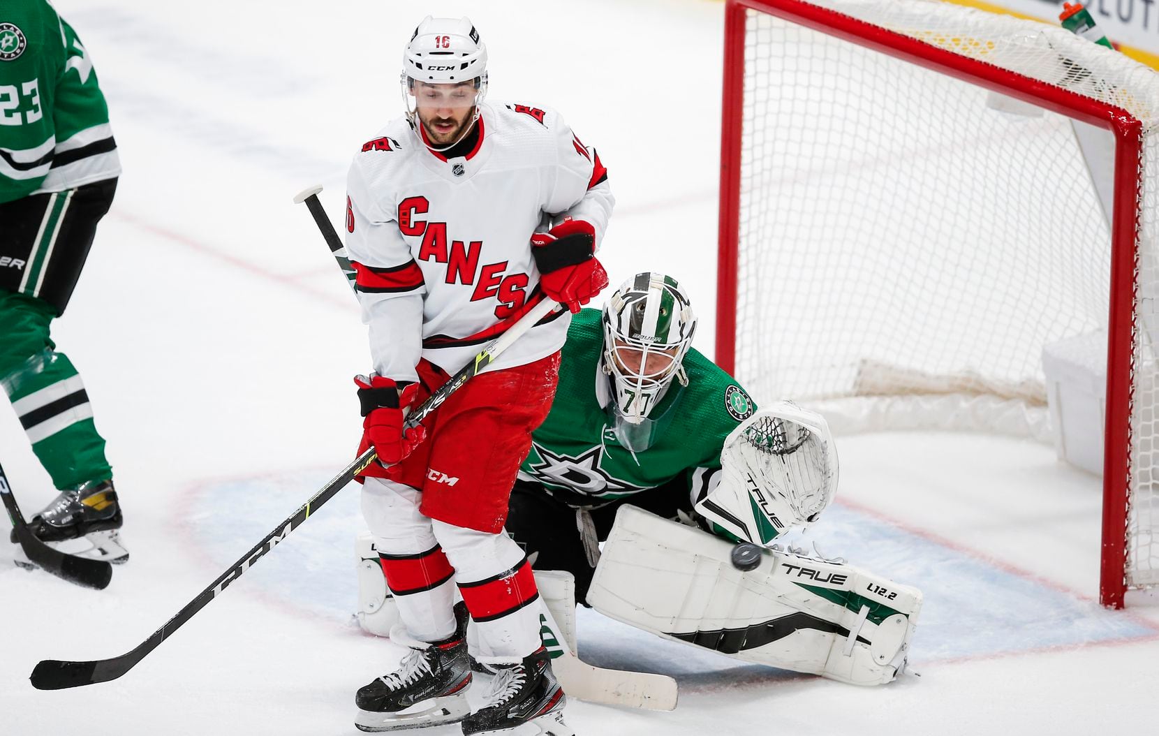 Carolina Hurricanes forward Vincent Trocheck (16) screens a shot as Dallas Stars goaltender Braden Holtby (70) makes the save during the first period of an NHL hockey game in Dallas, Tuesday, November 30, 2021. (Brandon Wade/Special Contributor)