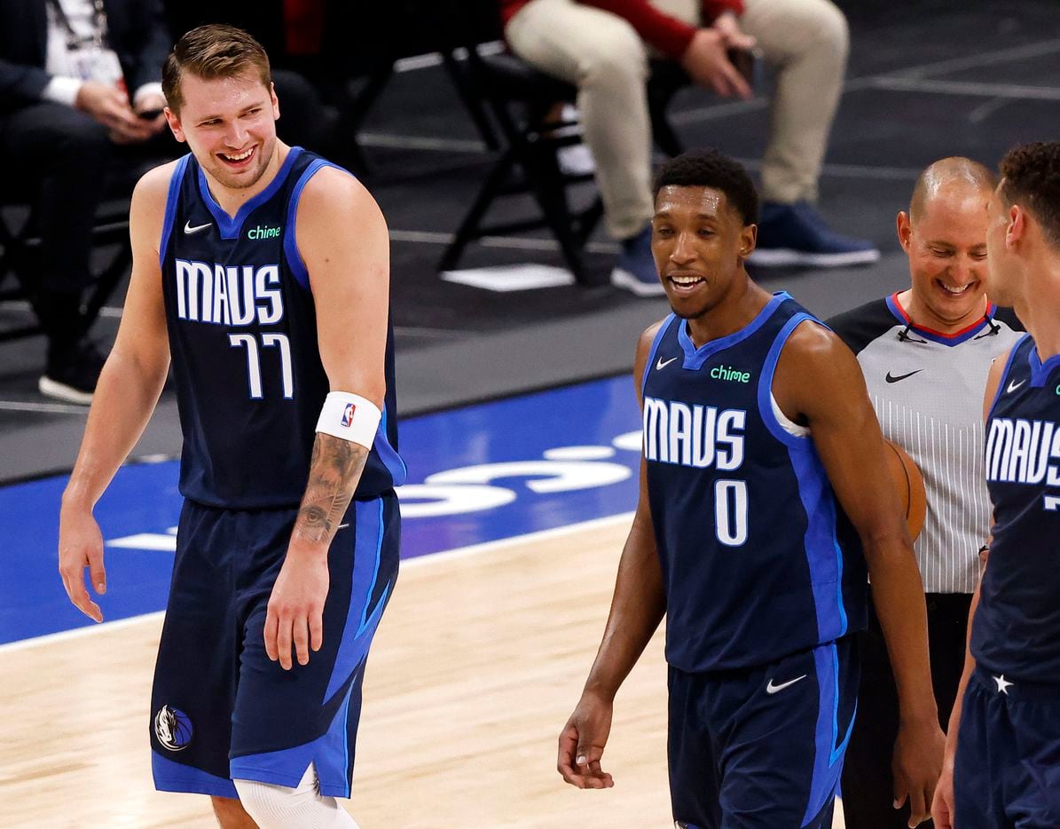 Dallas Mavericks guard Luka Doncic (77) and his teammates are all smiles as they leave the floor with a halftime lead over the Cleveland Cavaliers at the American Airlines Center in Dallas, Friday, May 7, 2021. (Tom Fox/The Dallas Morning News)