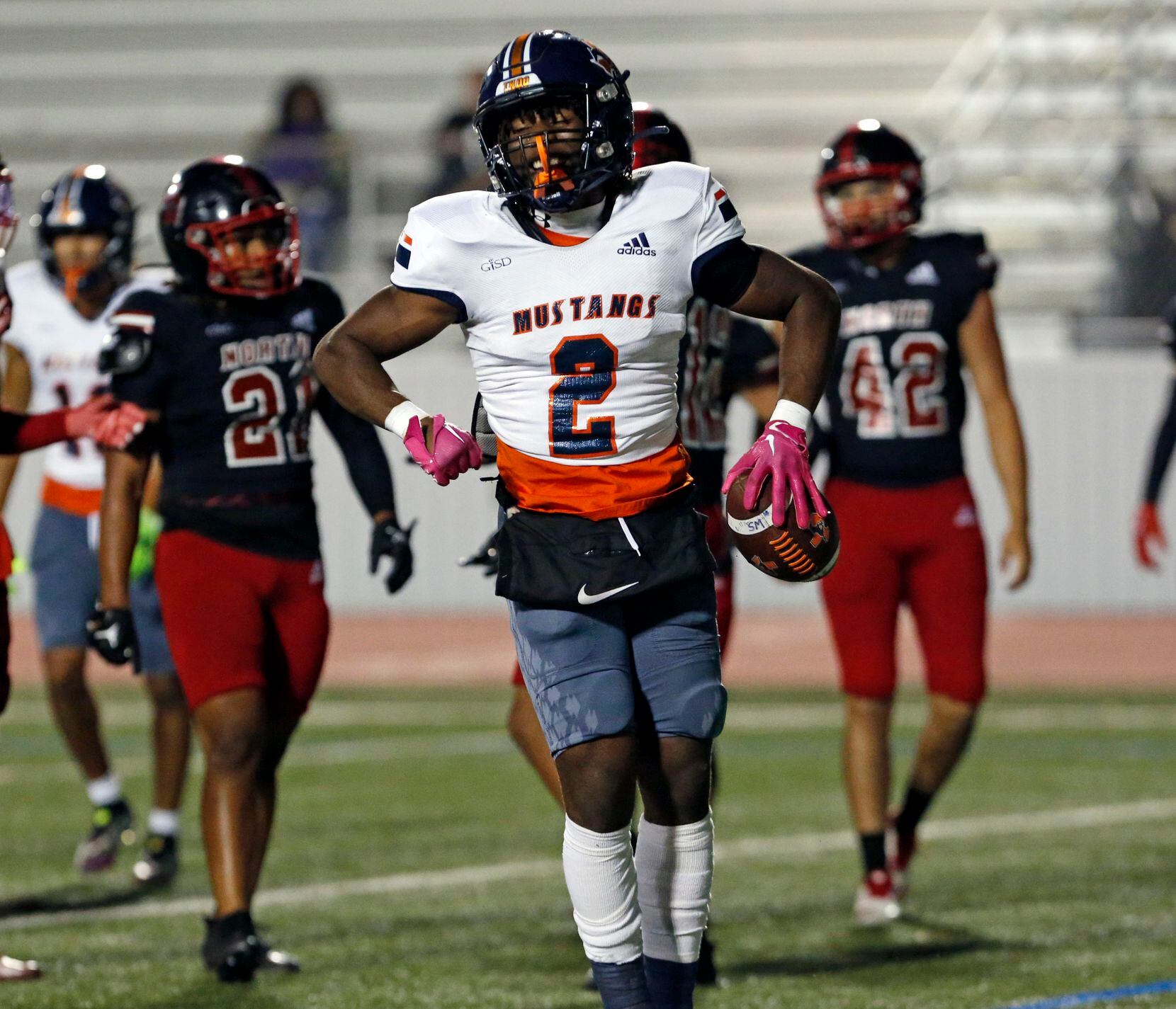 Sachse RB Pope Akanna (2) celebrates in the end zone after scoring a touchdown during the...