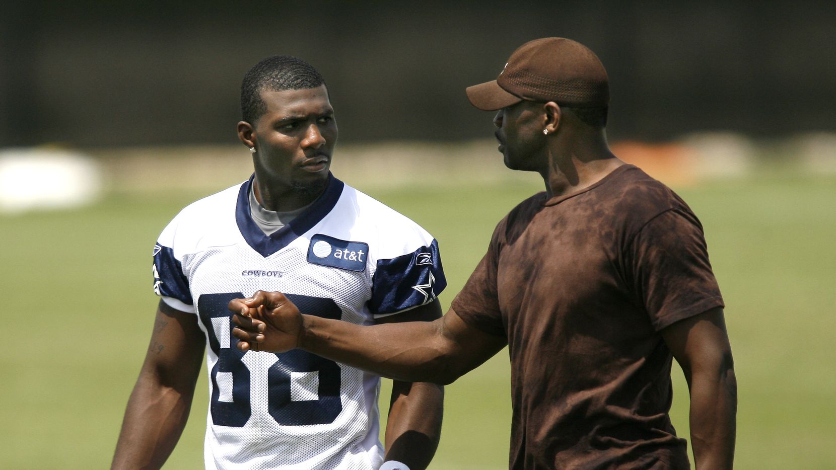 Dallas Cowboys wide receiver Dez Bryant (88) talks with former Dallas Cowboys player Michael...