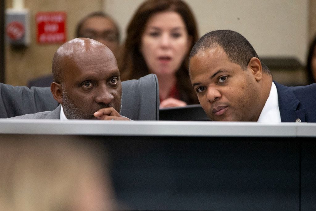 Dallas City Manager T.C. Broadnax (left) listens to Mayor Eric Johnson during a City Council...