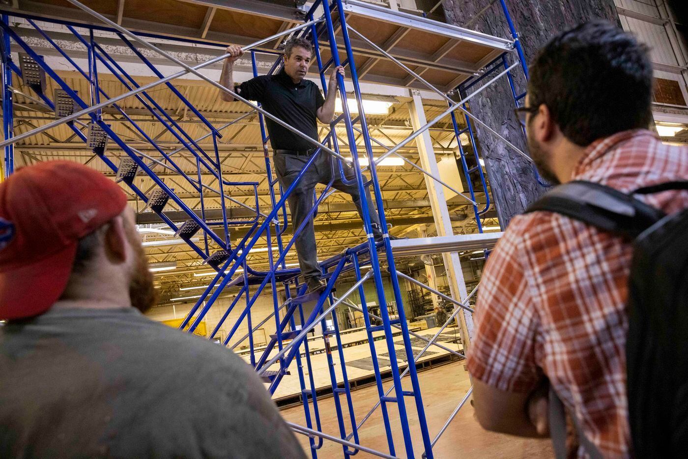 Director Tomer Zvulun (center) talks with his crew on the scaffolding that will be used for...