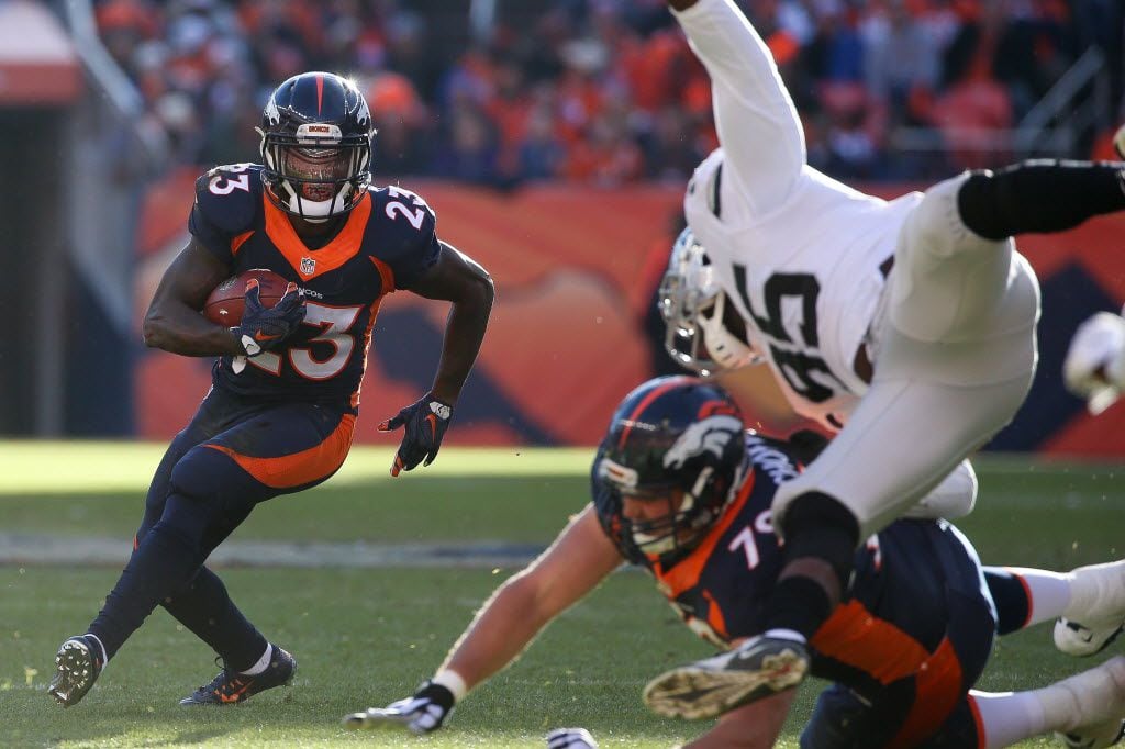 DENVER, CO - DECEMBER 13:  Running back Ronnie Hillman #23 of the Denver Broncos rushes...
