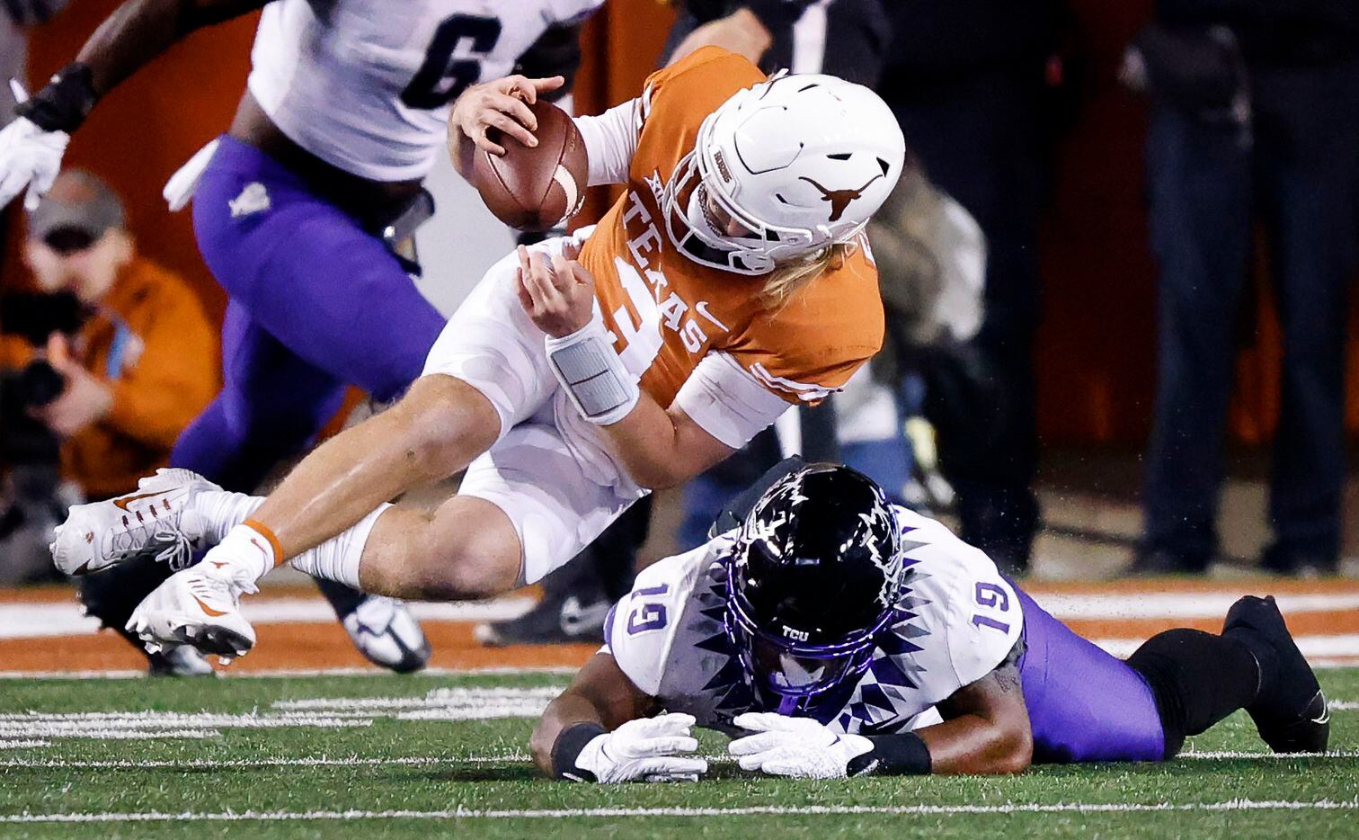 TCU Horned Frogs linebacker Shadrach Banks (19) tried to pounce on Texas Longhorns...
