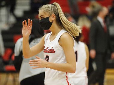 Frisco Liberty High School guard Lily Ziemkiewicz (3) waves to the crowd after the victory...