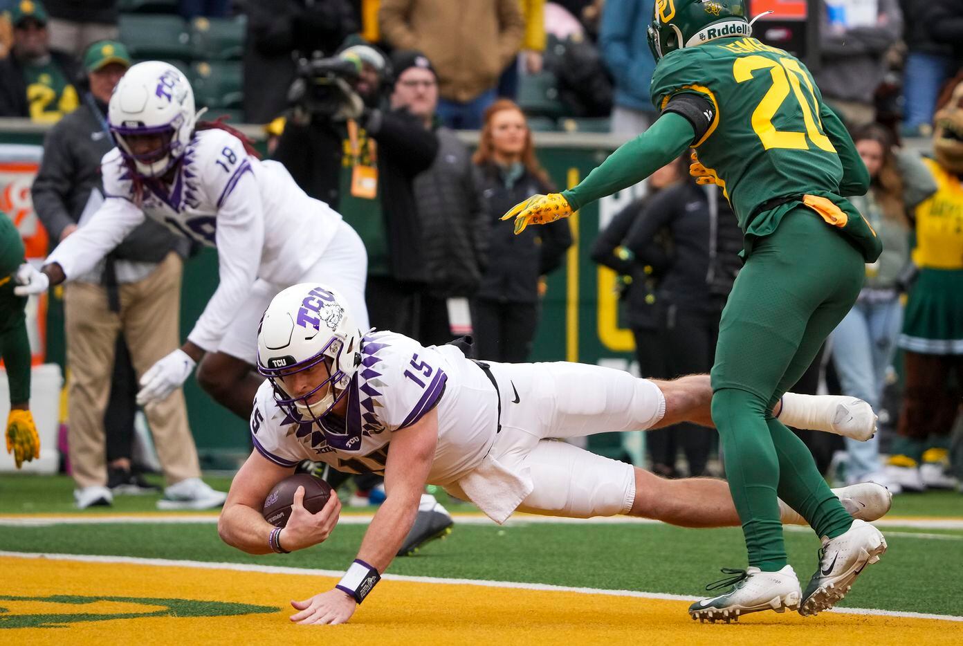 TCU quarterback Max Duggan (15) dives into the end zone for a touchdown during the first...